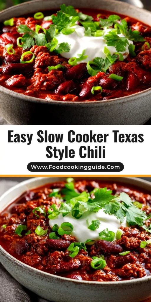 A close-up shot of a bowl of rich, red Slow Cooker Texas Style Chili, topped with shredded cheese and fresh cilantro. The chili is thick with tender chunks of beef.