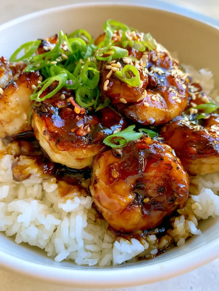 Honey Garlic Shrimp: The Ultimate 15-Minute Sticky Glazed Seafood Dinner 1 Pan-seared shrimp with golden-brown char marks being tossed in a honey garlic glaze. (Honey Garlic Shrimp)